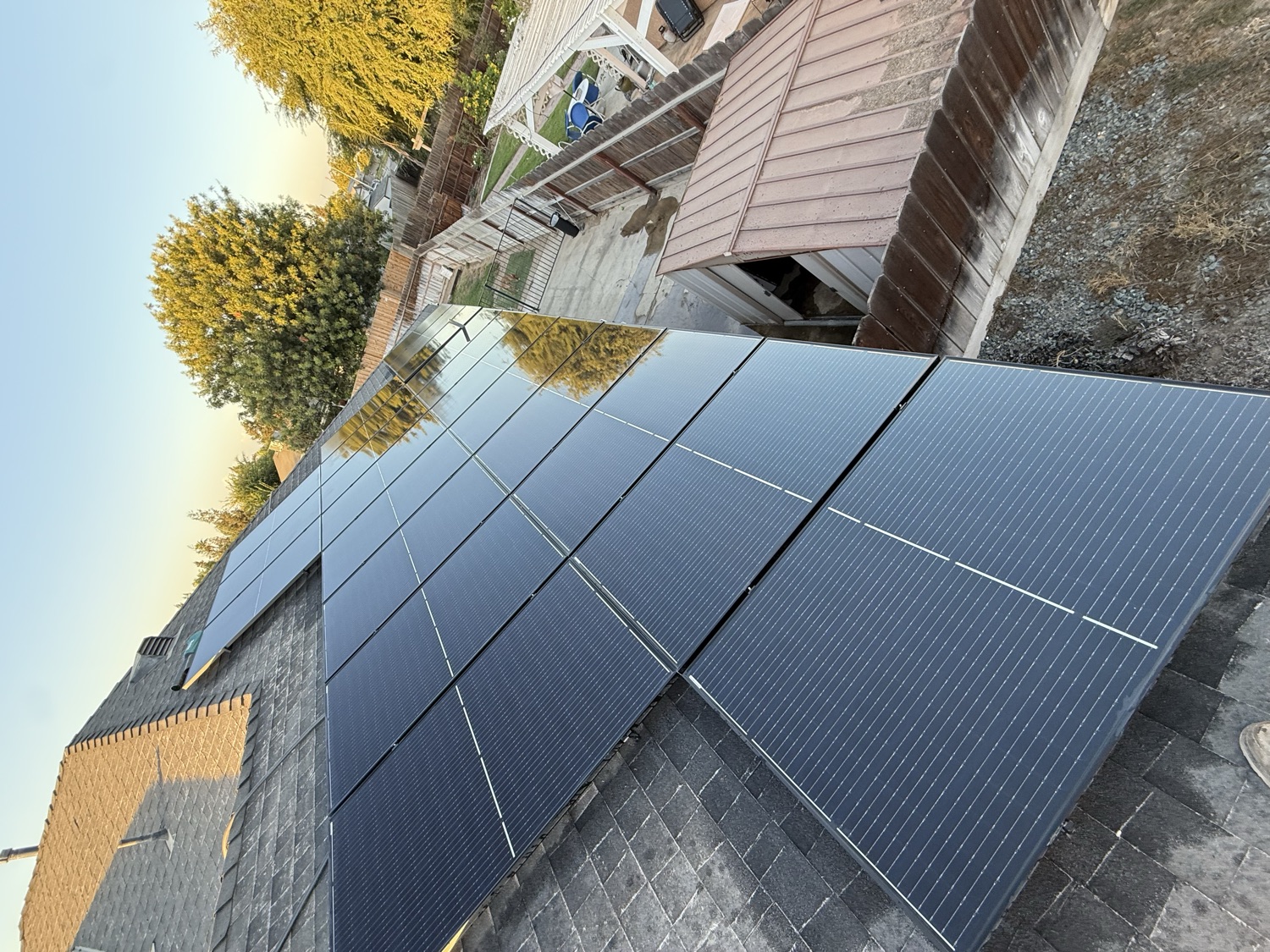 Clean rooftop solar array at golden hour by Garcia's Roof Cleaning Services in Fresno