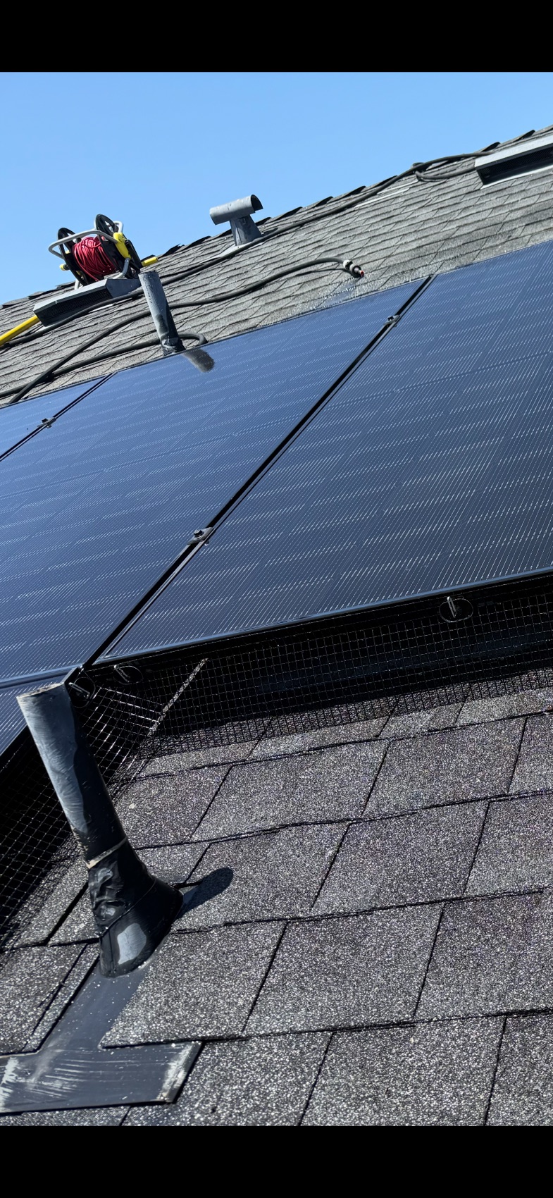 Solar panels with critter guard bird proofing installed by Garcia's Roof Cleaning Services