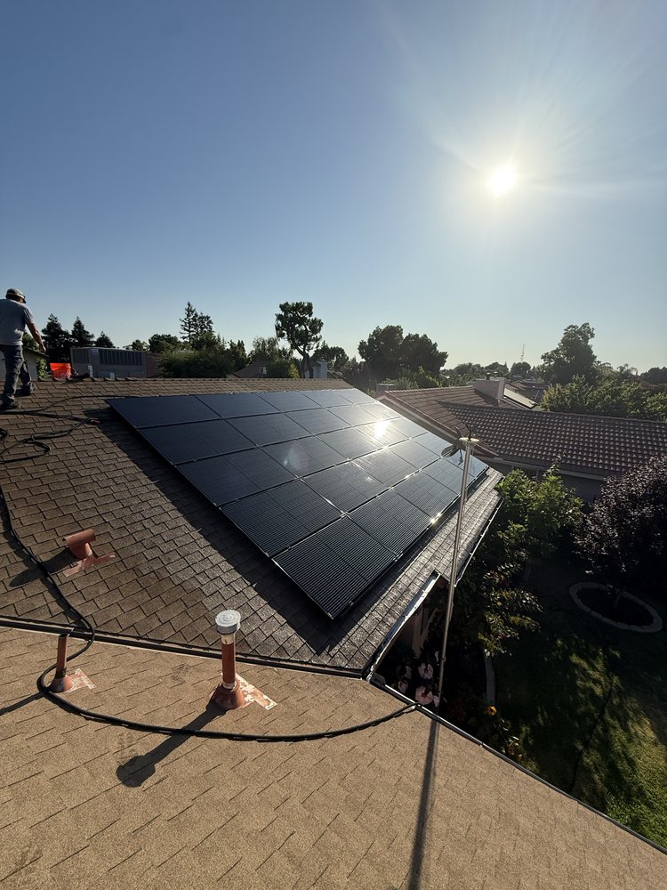Garcia's Roof Cleaning Services cleaning rooftop solar panels in Fresno